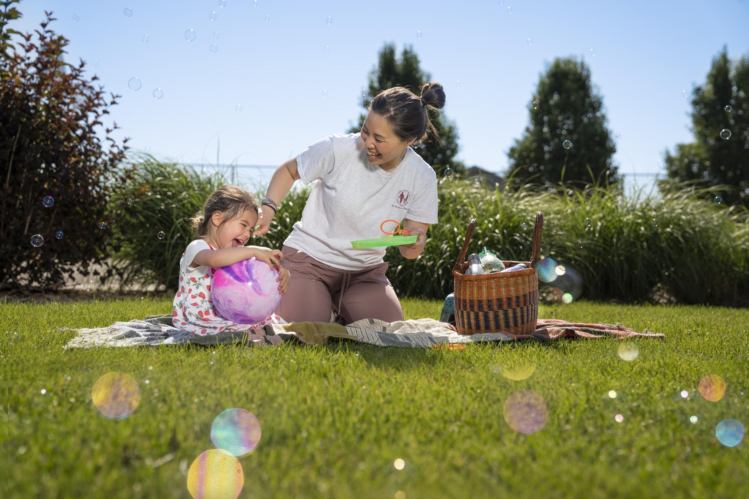 A mother and daughter having a picnic